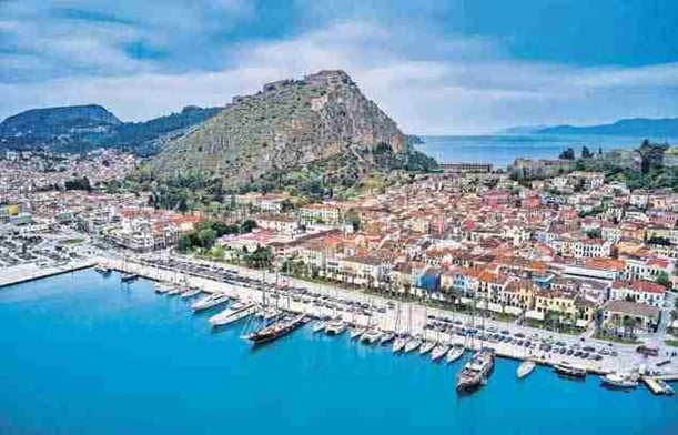 An aerial view of Nafplio, a coastal city known for its Venetian architecture and historic sites.